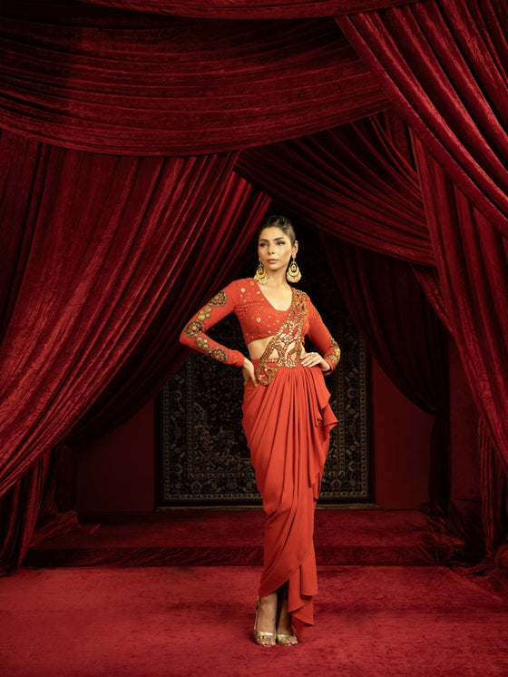 BURNT TERRACOTTA DRAPE SKIRT SET WITH EMBROIDERED CUTWORK PALLA & FULL SLEEVE BLOUSE