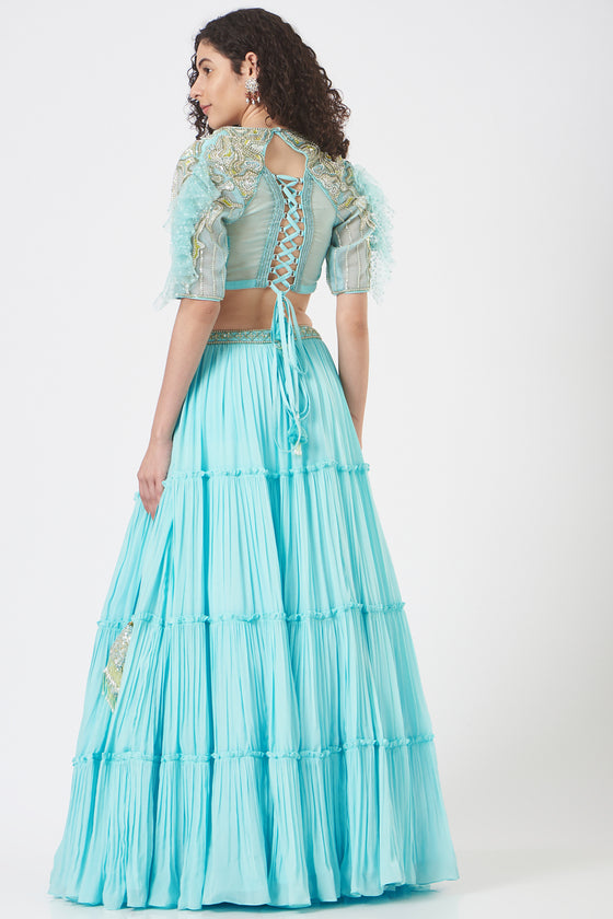 Stylised blouse with dreamy fin sleeve teamed with tiered lehenga and mesh dupatta Backview